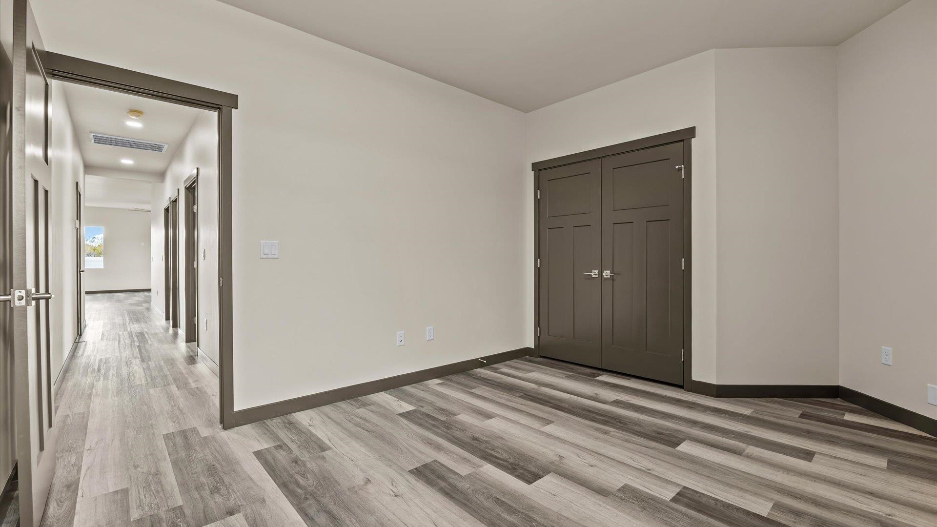 635 Anvil Way Grand Junction, CO 81504 - Photo 25 of 30 a view of a room with wooden floor and a bathroom