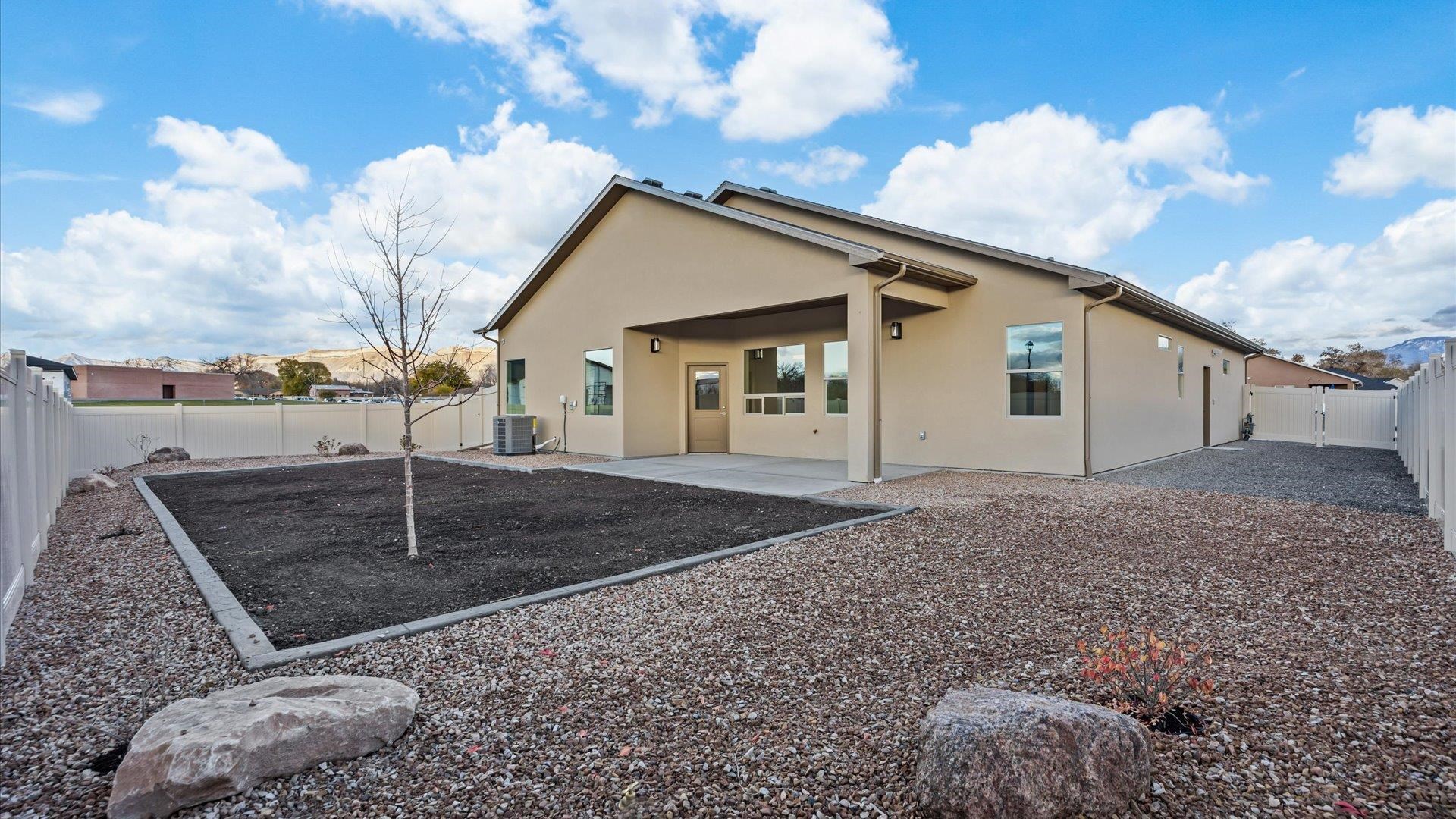 635 Anvil Way Grand Junction, CO 81504 - Photo 28 of 30 a view of a house with a backyard