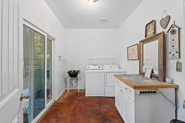 a utility room with dryer and washer