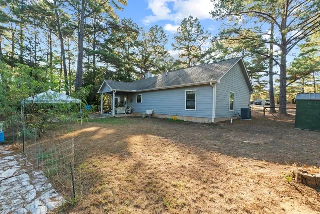 a house with trees in the background