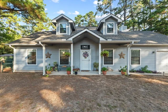 a front view of a house with a outdoor space