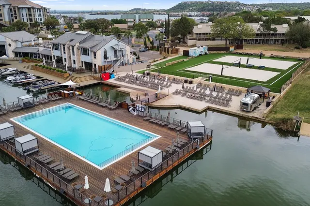 an aerial view of a house with lake view