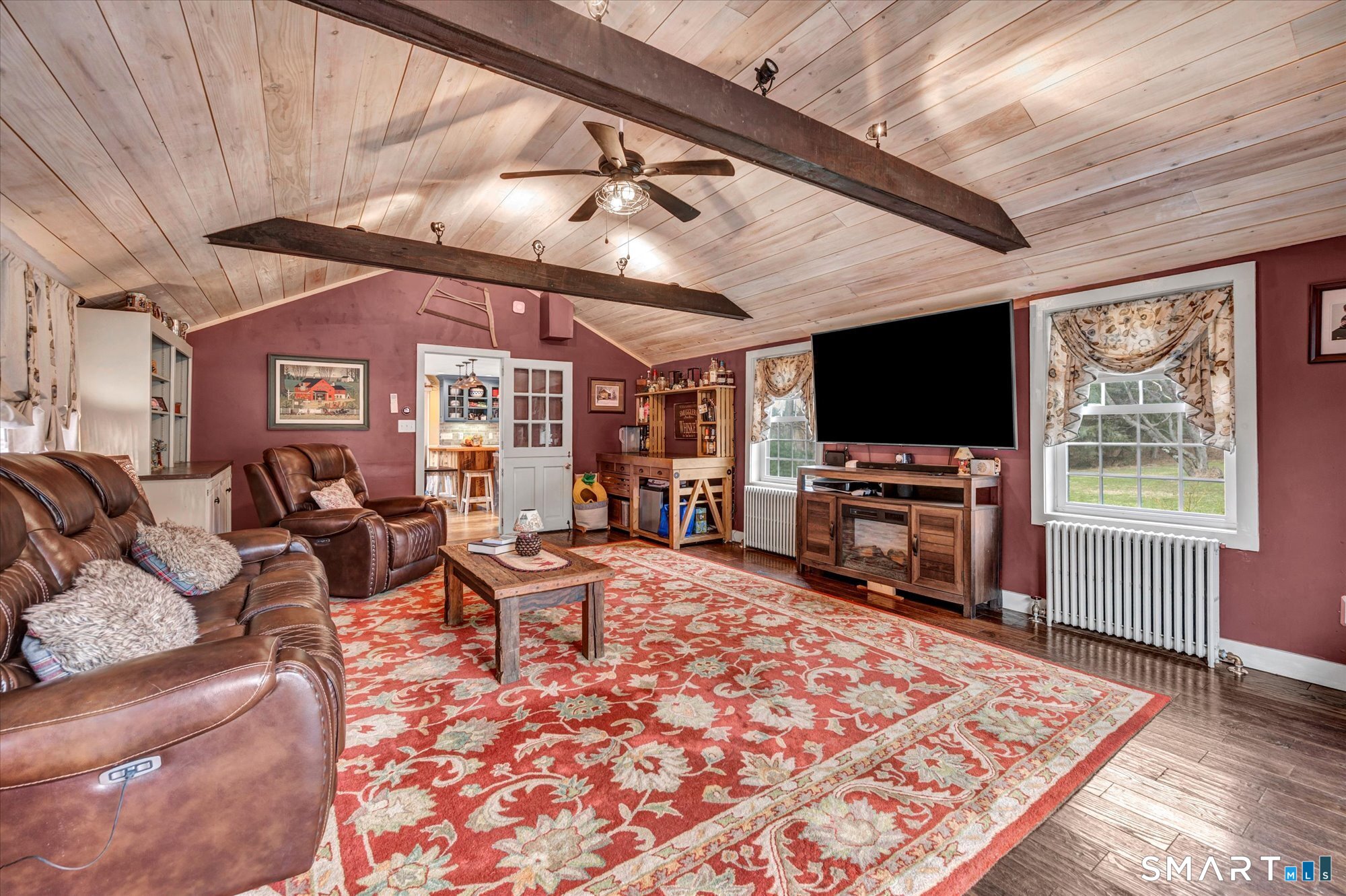 566 Maple Street Litchfield, CT 06759 - Photo 12 of 34 a living room with furniture and a flat screen tv