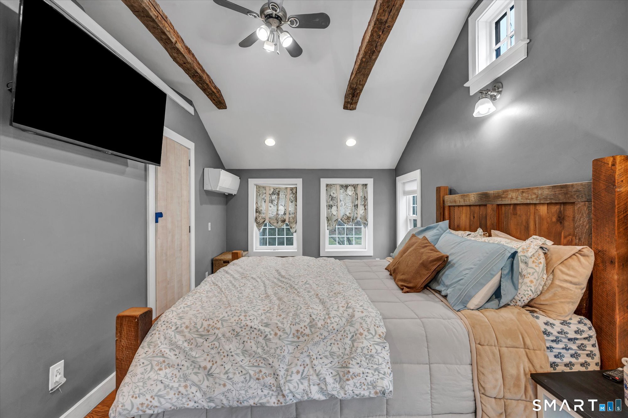 566 Maple Street Litchfield, CT 06759 - Photo 17 of 34 a large bed sitting in a bedroom next to a window