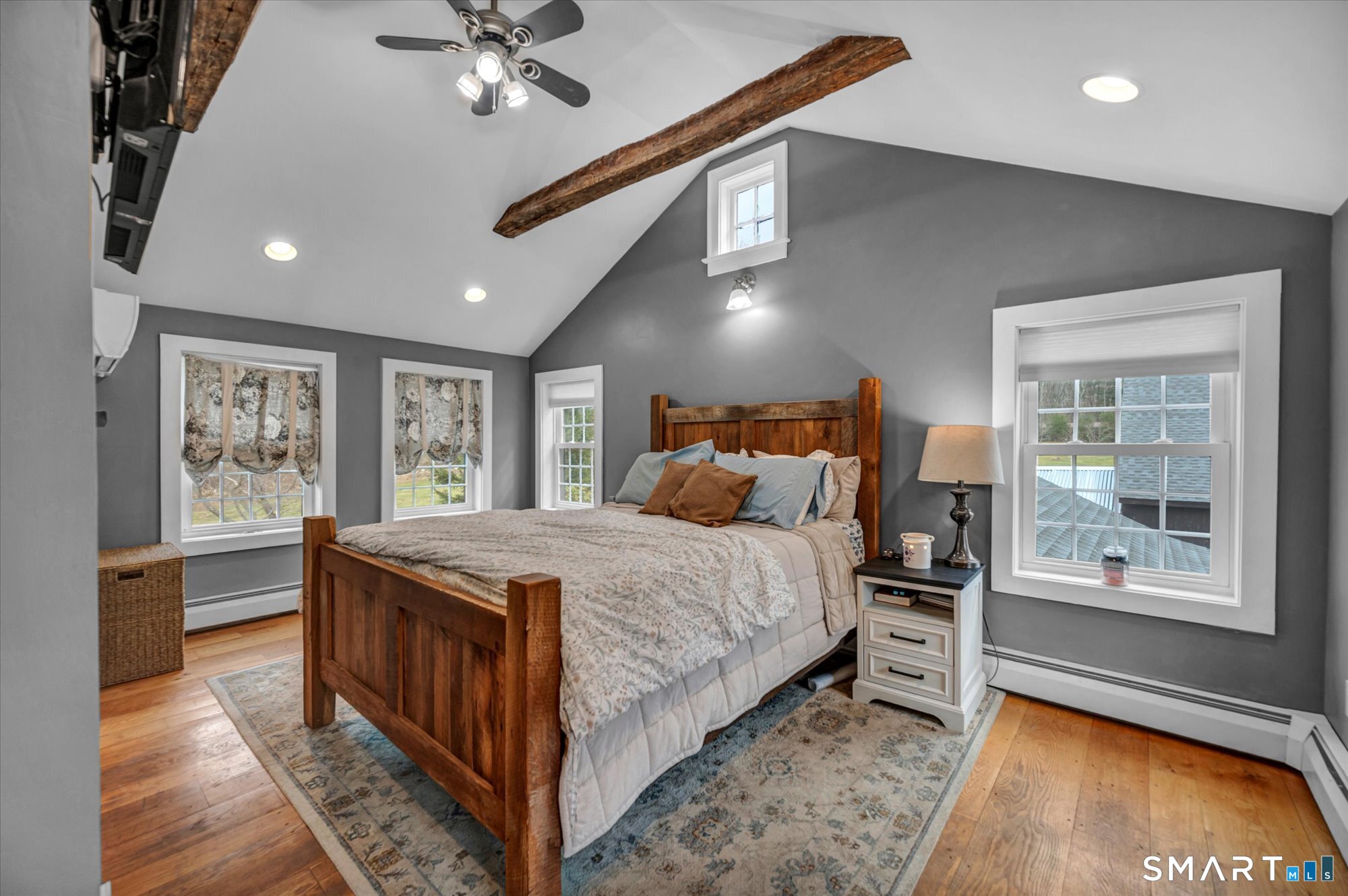 566 Maple Street Litchfield, CT 06759 - Photo 18 of 34 a bedroom with a bed and a large window