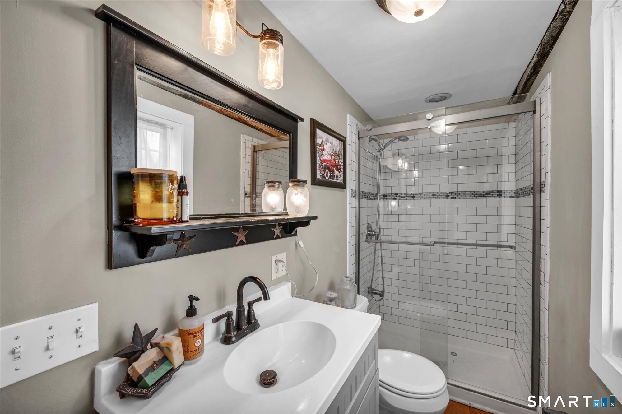 566 Maple Street Litchfield, CT 06759 - Photo 23 of 34 a bathroom with a sink a toilet and shower