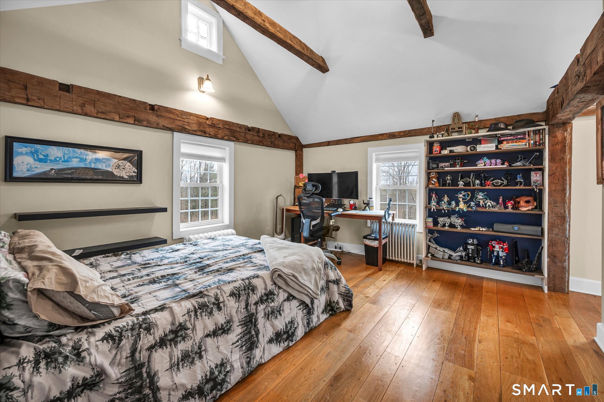 566 Maple Street Litchfield, CT 06759 - Photo 24 of 34 a bedroom with a bed a dresser and book shelf