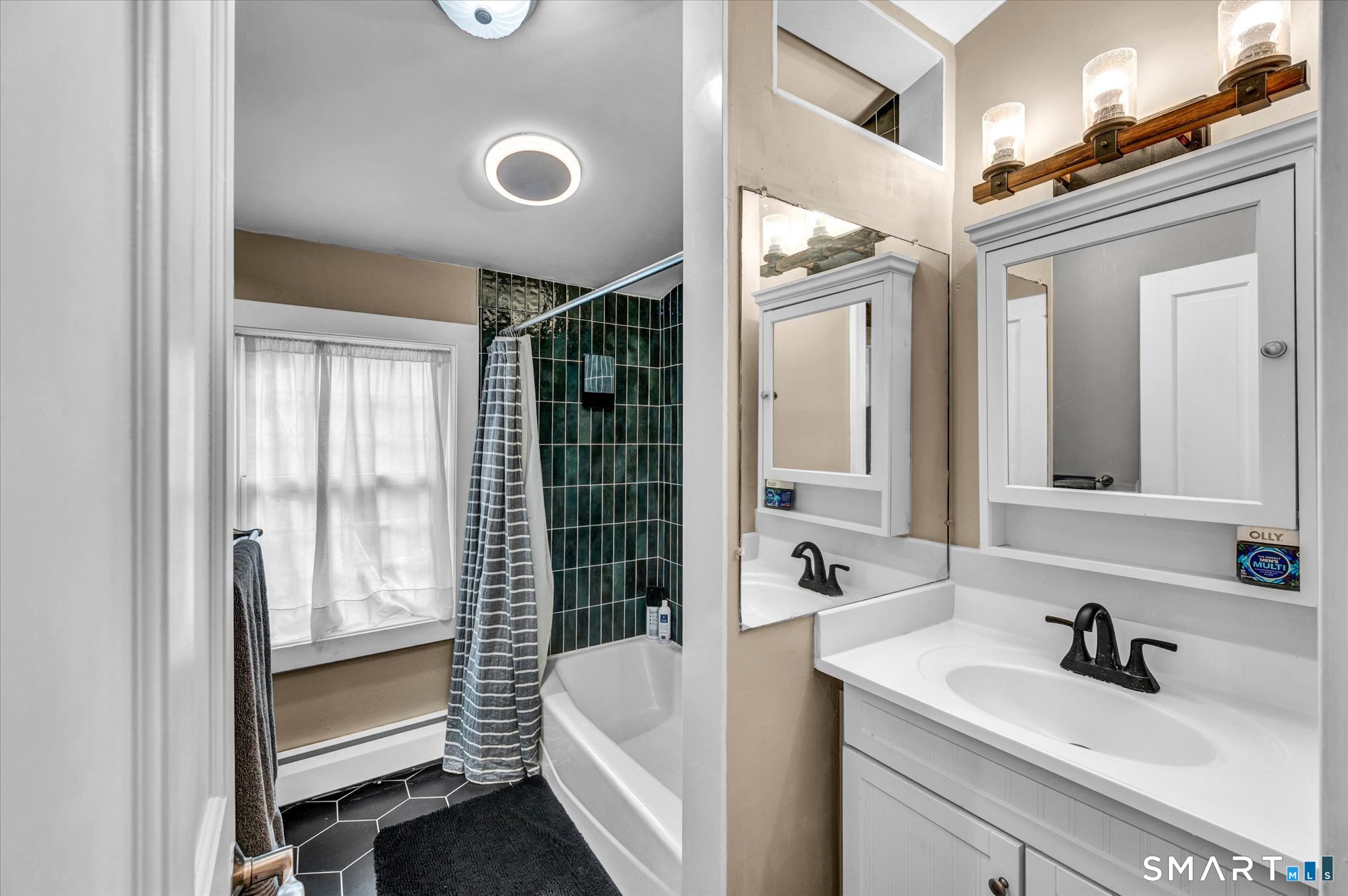 566 Maple Street Litchfield, CT 06759 - Photo 25 of 34 a bathroom with a sink and a mirror