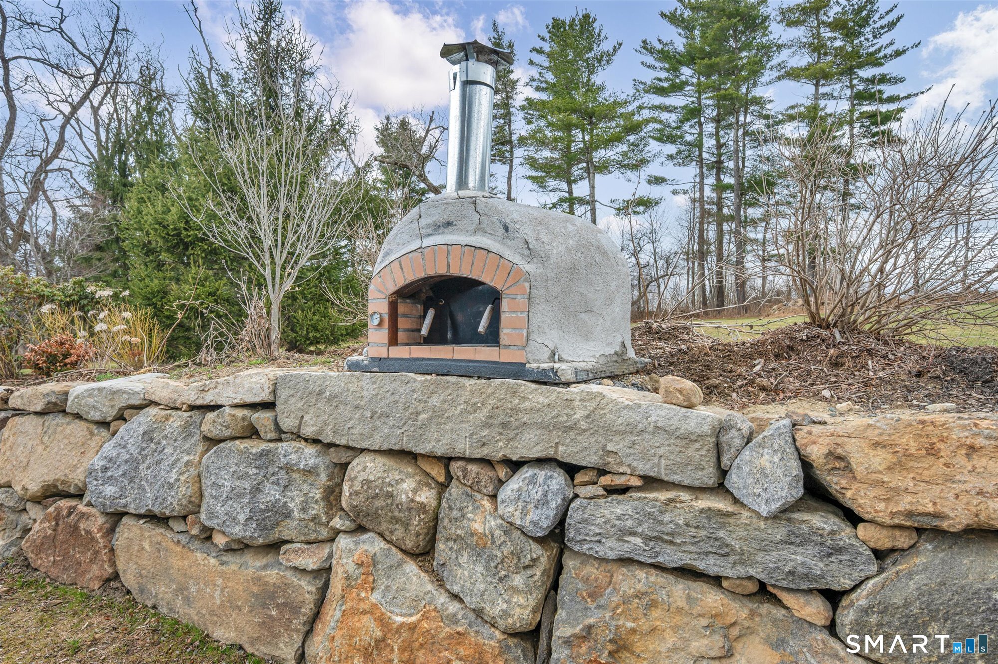 566 Maple Street Litchfield, CT 06759 - Photo 27 of 34 a front view of a house with a yard