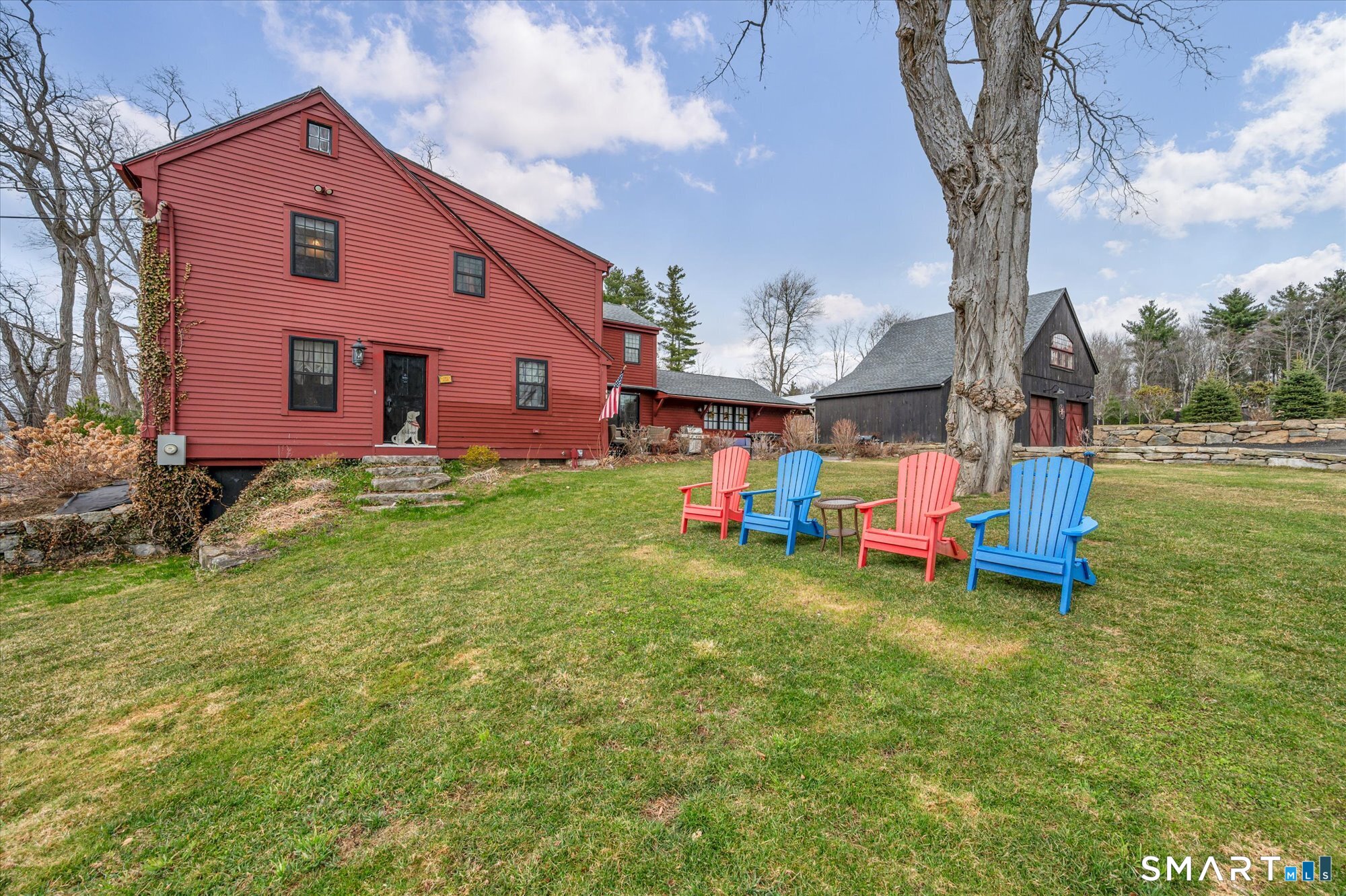 566 Maple Street Litchfield, CT 06759 - Photo 28 of 34 a backyard of a house with table and chairs