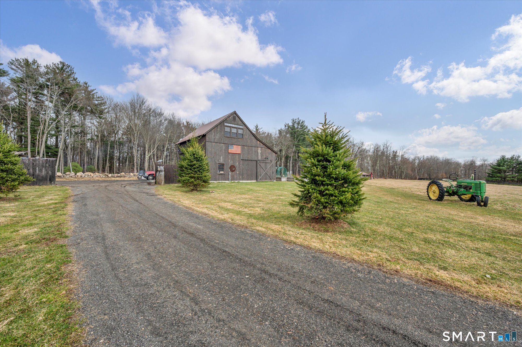 566 Maple Street Litchfield, CT 06759 - Photo 4 of 34 a view of a road with a house in the background