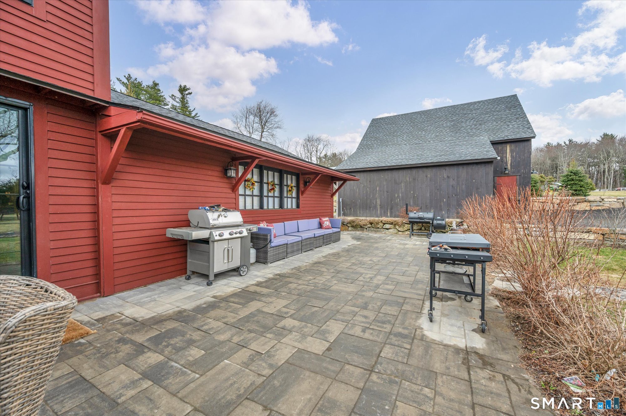 566 Maple Street Litchfield, CT 06759 - Photo 5 of 34 a view of a chairs and table in the back yard of the house
