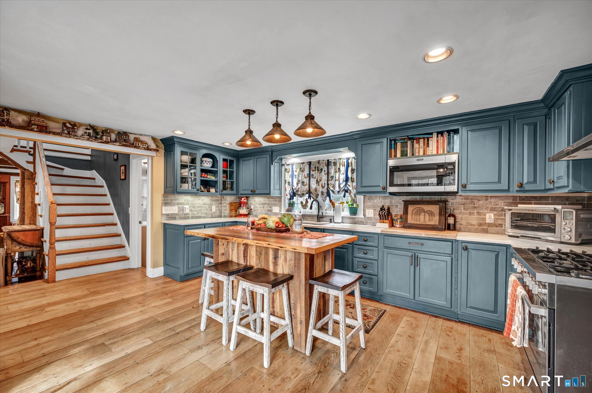 566 Maple Street Litchfield, CT 06759 - Photo 9 of 34 a kitchen with stainless steel appliances granite countertop a kitchen island a stove and a cabinets