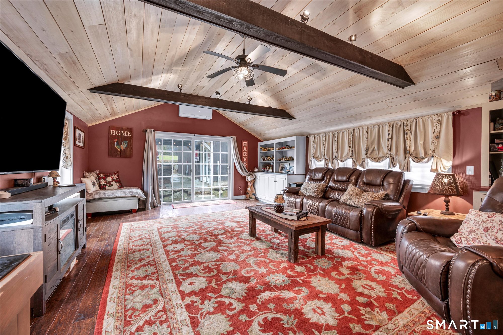 566 Maple Street Litchfield, CT 06759 - Photo 10 of 34 a living room with furniture and a flat screen tv