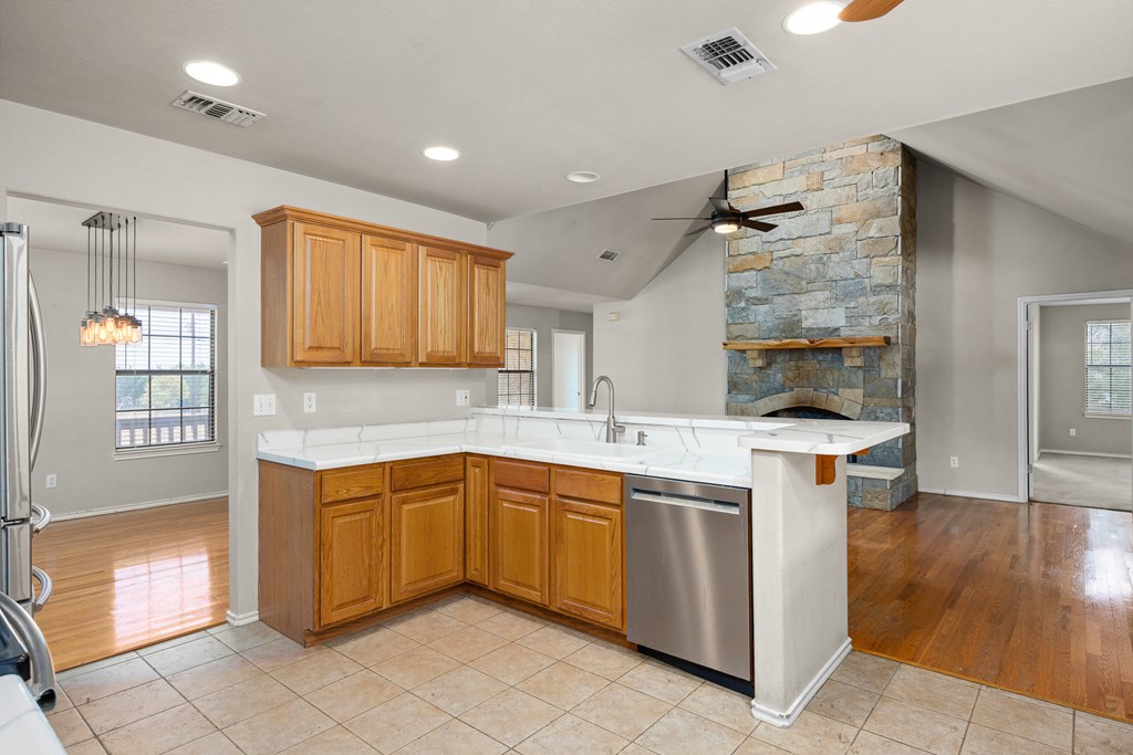 160 Rhum Road Kerrville, TX 78028 - Photo 11 of 42 a kitchen with a sink window and cabinets