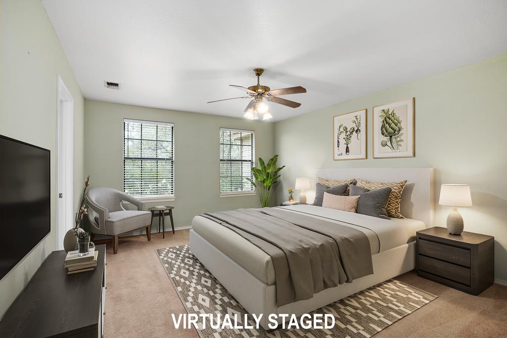 160 Rhum Road Kerrville, TX 78028 - Photo 15 of 42 a bedroom with a bed couches and a flat tv screen