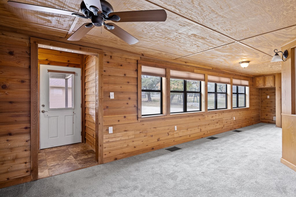 160 Rhum Road Kerrville, TX 78028 - Photo 23 of 42 wooden floor in an empty room with a window