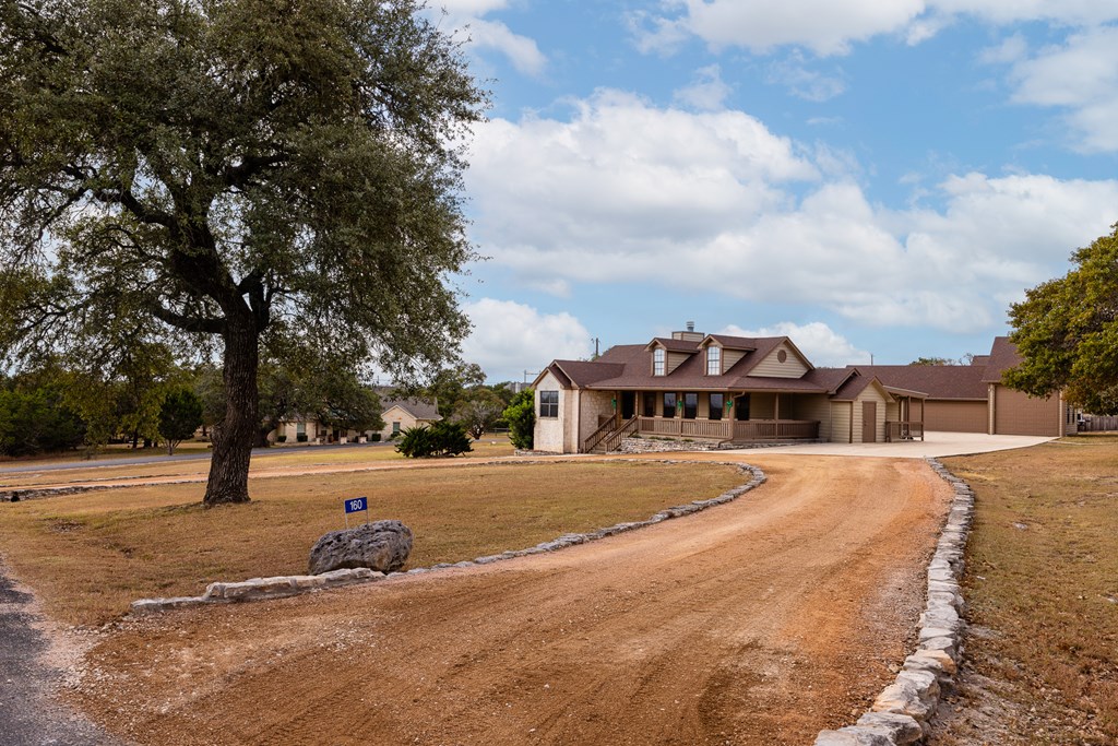 160 Rhum Road Kerrville, TX 78028 - Photo 39 of 42 a front view of a house with a yard and garage