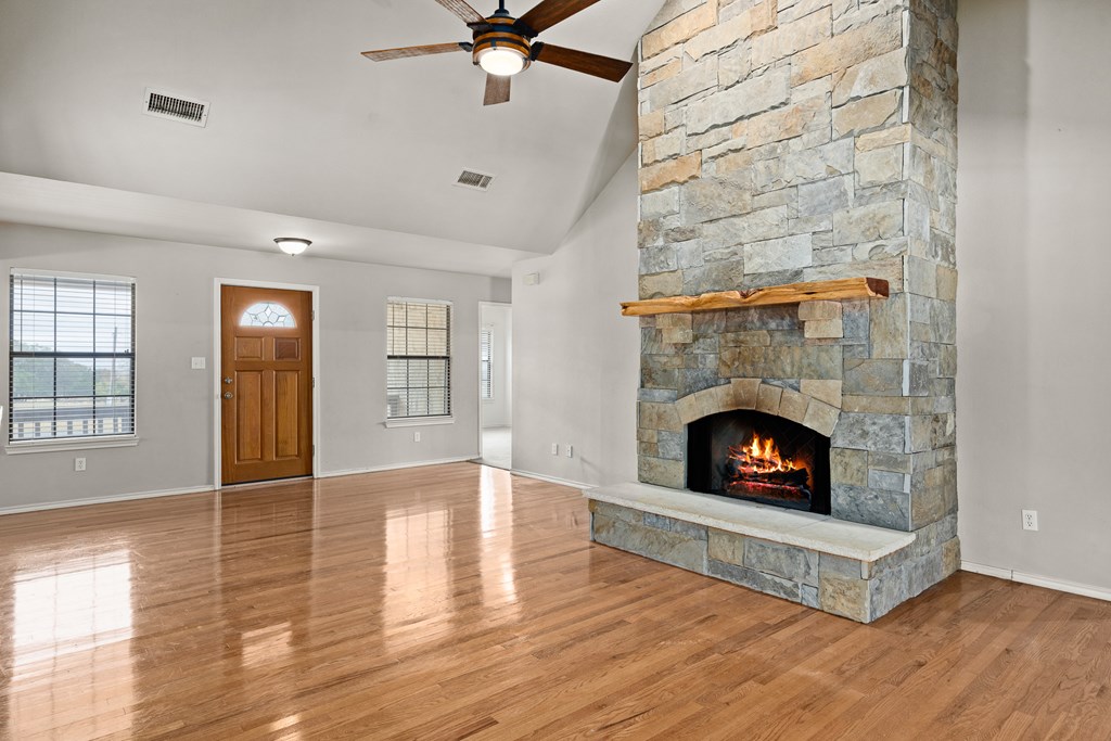 160 Rhum Road Kerrville, TX 78028 - Photo 5 of 42 wooden floor fireplace and windows in a room