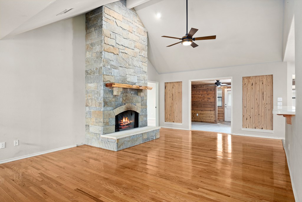 160 Rhum Road Kerrville, TX 78028 - Photo 6 of 42 a living room with furniture and a fireplace