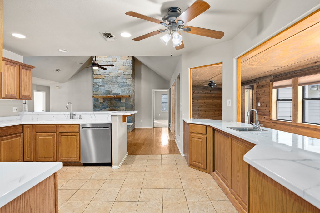 160 Rhum Road Kerrville, TX 78028 - Photo 8 of 42 a large kitchen with cabinets and a stove