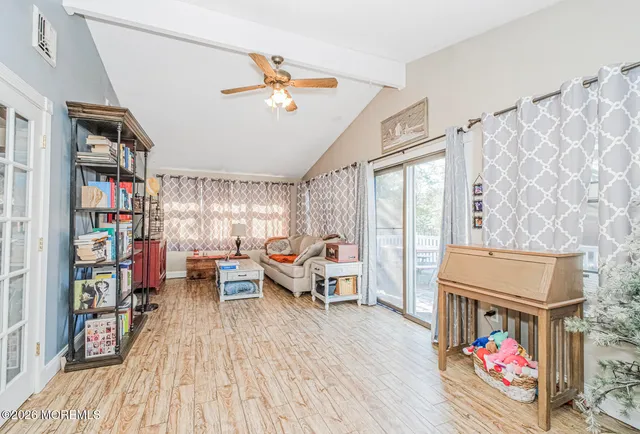 a bedroom with furniture and a book shelf