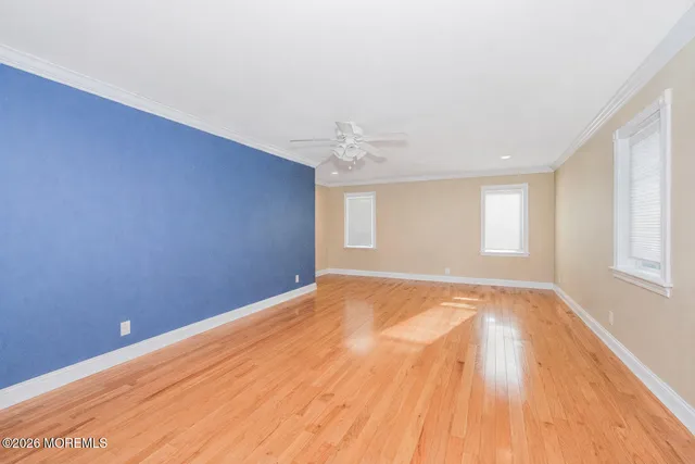a large bathroom with a tub sink and mirror