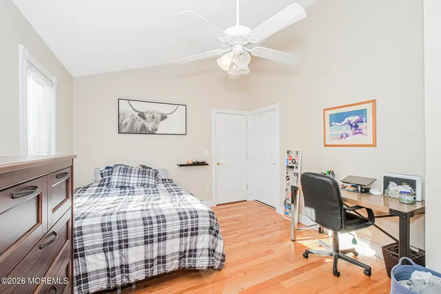 a bedroom with a bed and a table in it