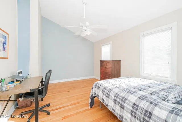 a bathroom with a sink a toilet and shower curtain