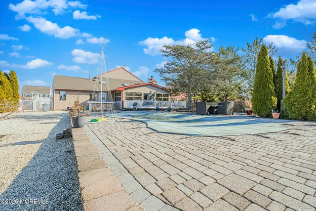 a view of a house with basketball court