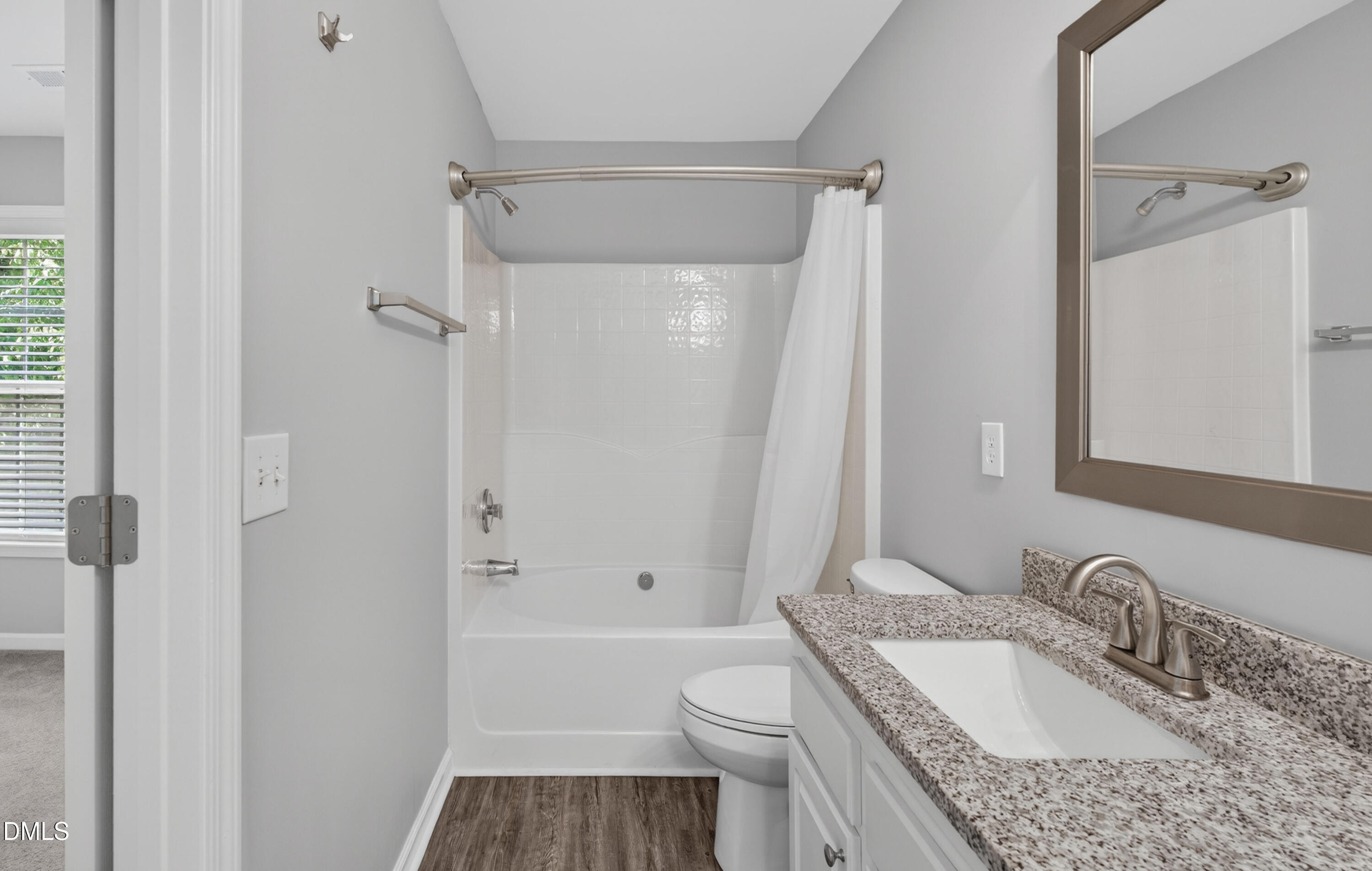 5421 Golden Arrow Lane Raleigh, NC 27613 - Photo 31 of 49 a bathroom with a granite countertop sink toilet and shower
