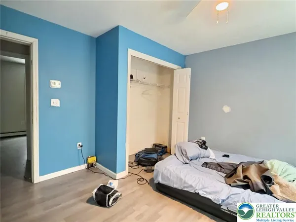 a bedroom with bed and a window