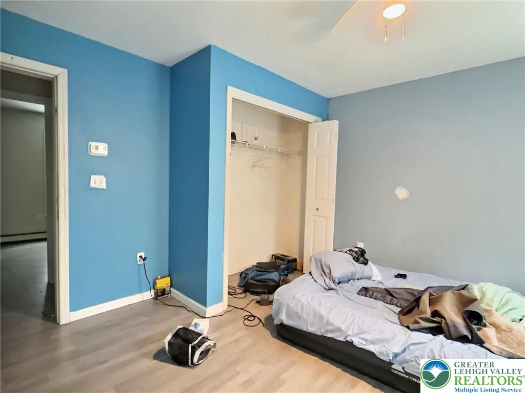 375 Marcel Drive Dingmans Ferry, PA 18328 - Photo 16 of 37 a bedroom with bed and a window