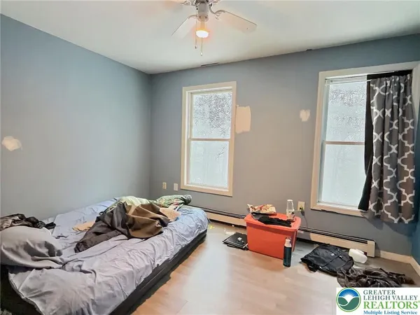 a bedroom with bed and a window