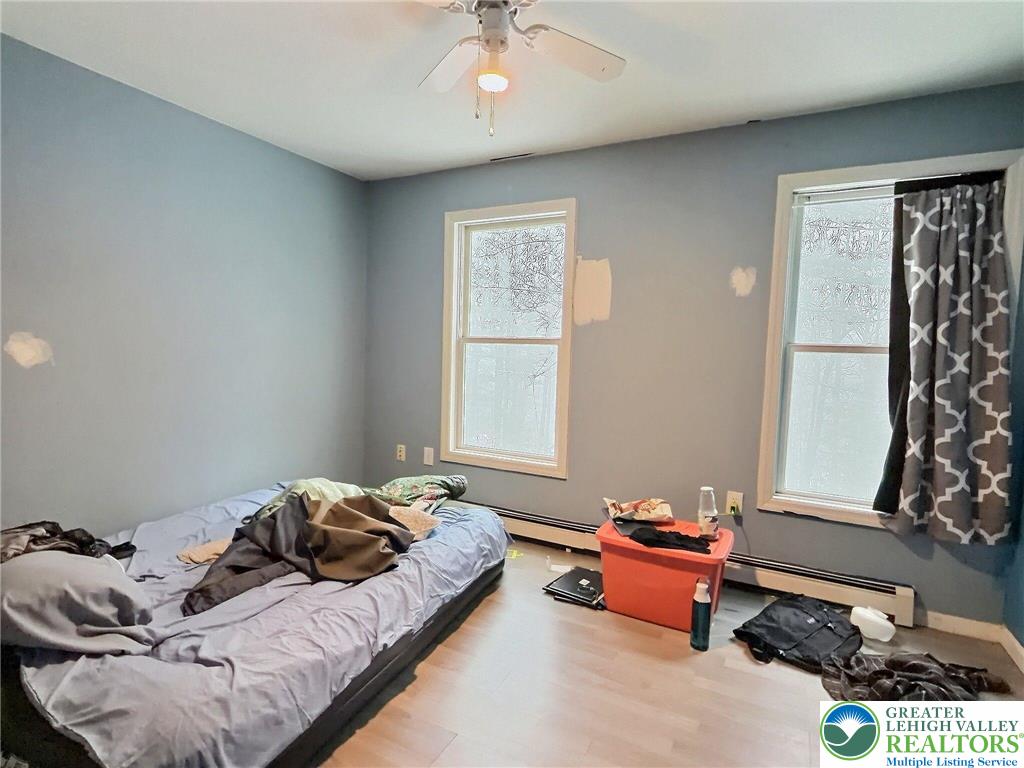 375 Marcel Drive Dingmans Ferry, PA 18328 - Photo 17 of 37 a bedroom with bed and a window