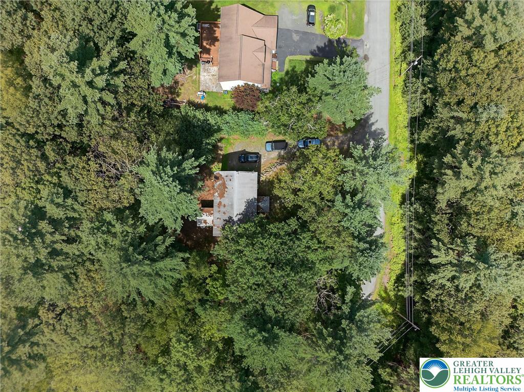 375 Marcel Drive Dingmans Ferry, PA 18328 - Photo 26 of 37 an aerial view of a house with a yard