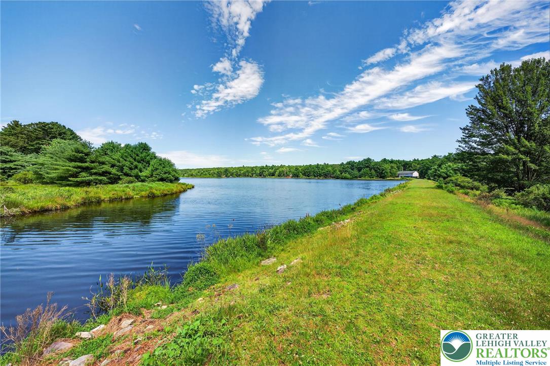 375 Marcel Drive Dingmans Ferry, PA 18328 - Photo 31 of 37 a view of a house with a lake view