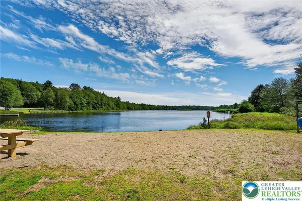 a view of a pool with a yard