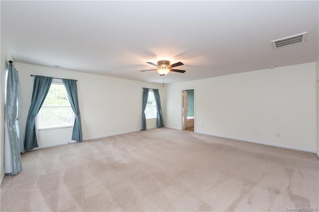 1132 Spicewood Pines Road Fort Mill, SC 29708 - Photo 15 of 24 a view of a livingroom with a ceiling fan and window