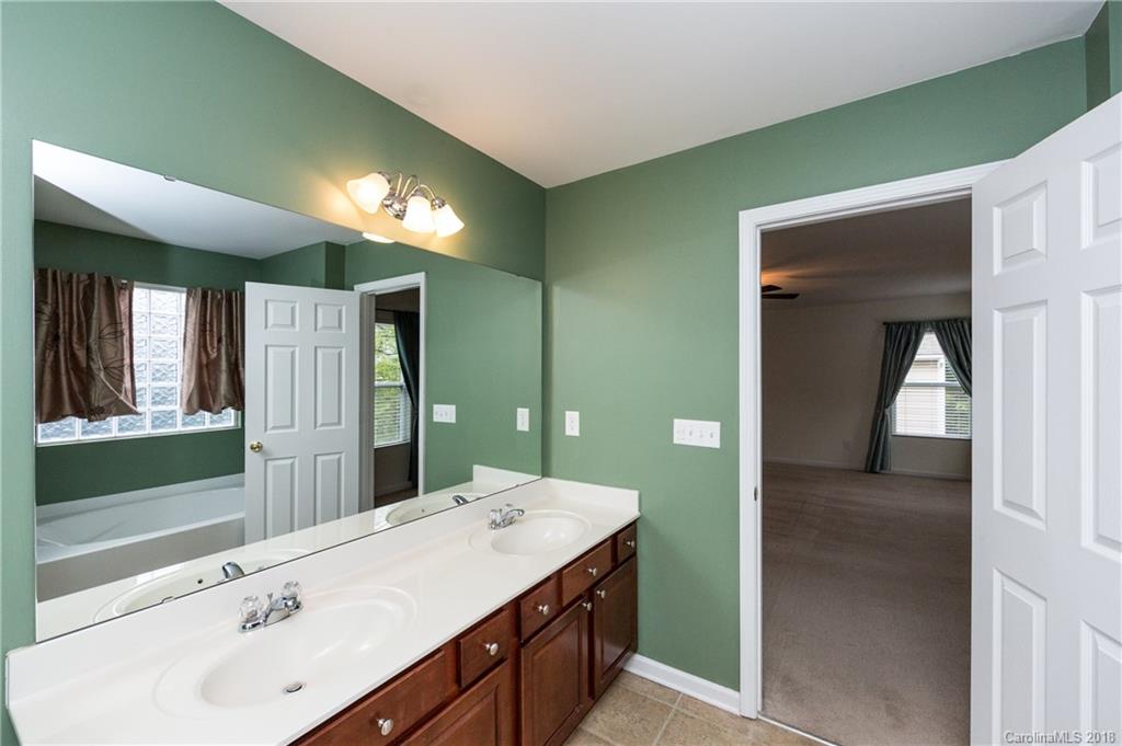1132 Spicewood Pines Road Fort Mill, SC 29708 - Photo 16 of 24 a bathroom with a sink and a mirror