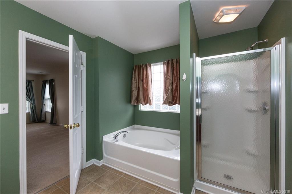 1132 Spicewood Pines Road Fort Mill, SC 29708 - Photo 17 of 24 a bathroom with a bathtub and shower
