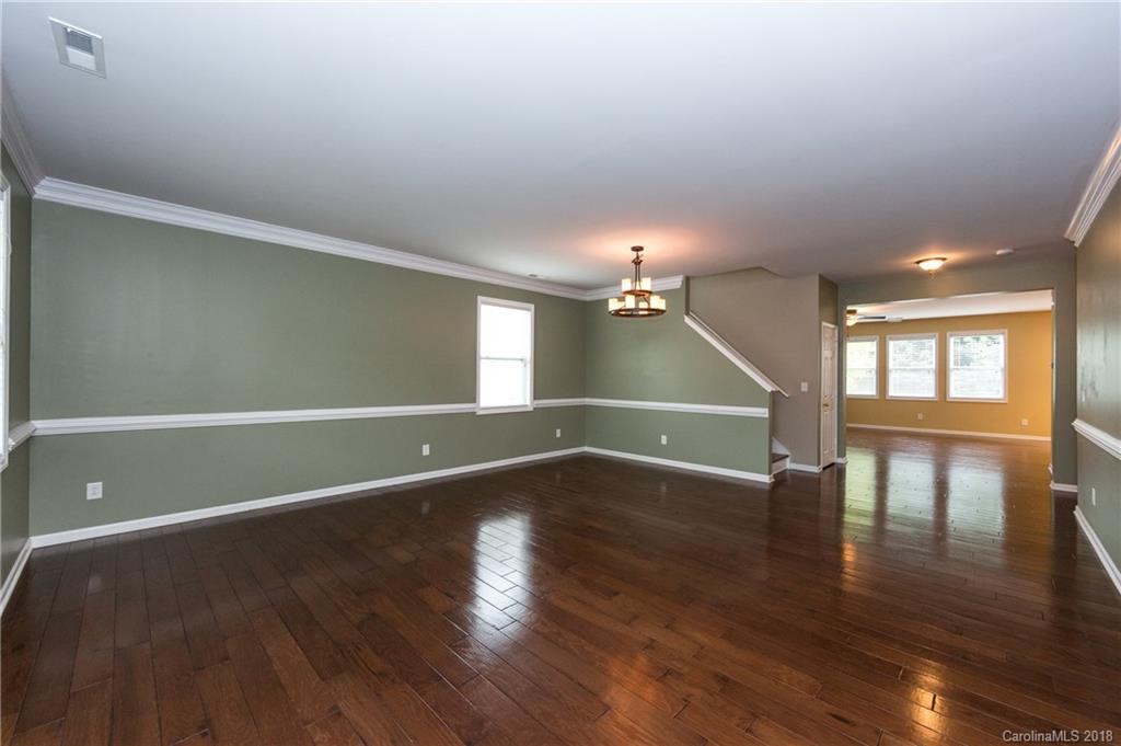 1132 Spicewood Pines Road Fort Mill, SC 29708 - Photo 4 of 24 a view of an empty room with wooden floor and a window