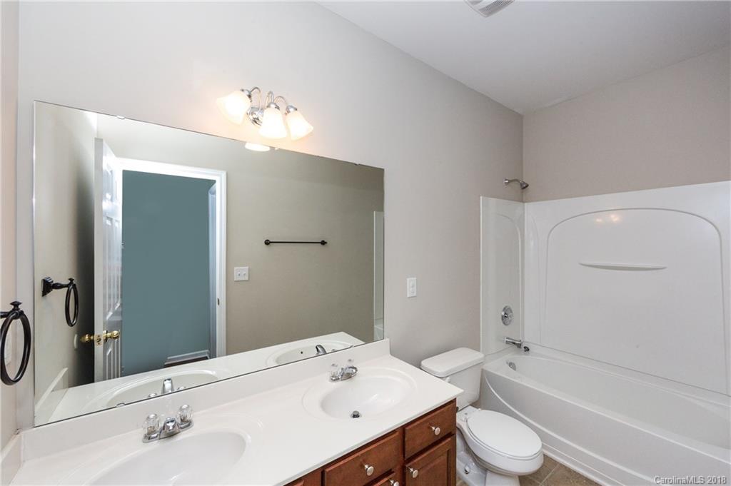 1132 Spicewood Pines Road Fort Mill, SC 29708 - Photo 6 of 24 a bathroom with a sink a toilet and shower