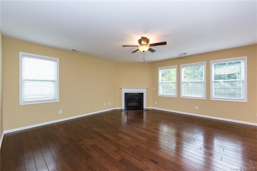 1132 Spicewood Pines Road Fort Mill, SC 29708 - Photo 8 of 24 a view of an empty room with a window and wooden floor