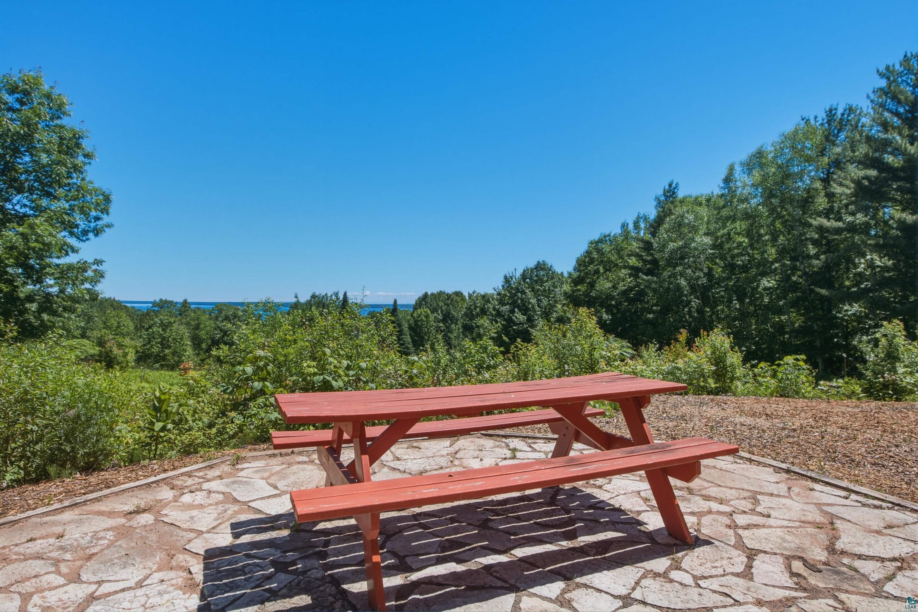 86270 Meyers-Olson Road Bayfield, WI 54814 - Photo 24 of 33 Outdoor patio featuring flagstone paving and a wooded backdrop