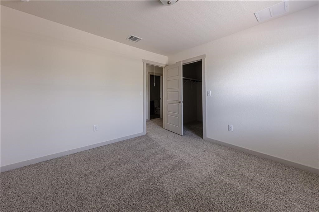 1801 Bonham Lane Round Rock, TX 78664 - Photo 15 of 24 a view of an empty room with closet