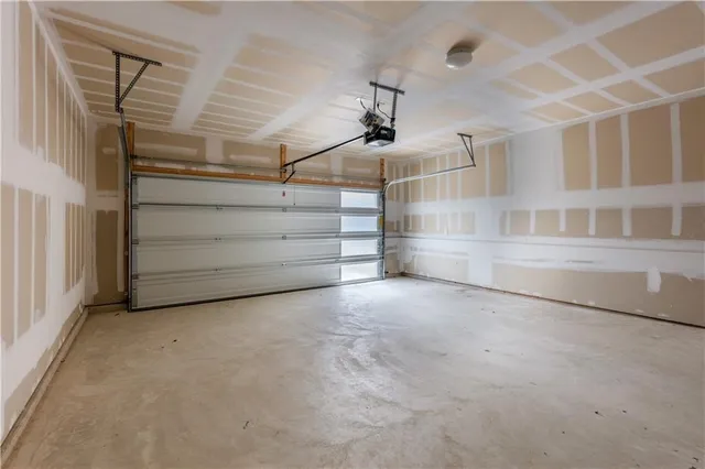 a view of an empty room with a white walls