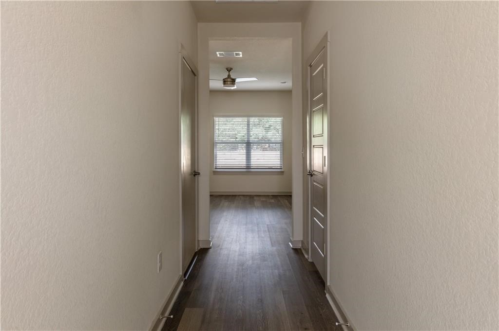 1801 Bonham Lane Round Rock, TX 78664 - Photo 4 of 24 wooden floor in an empty room with a window
