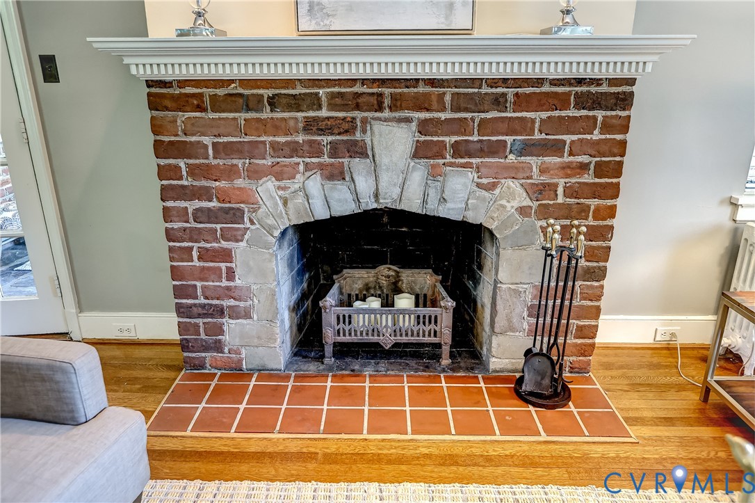 4814 Riverside Drive Richmond, VA 23225 - Photo 11 of 39 a view of empty room with wooden floor and fireplace