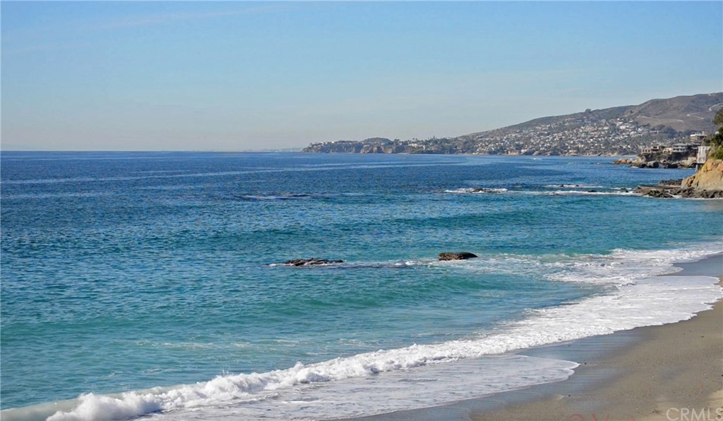 a view of a field with an ocean